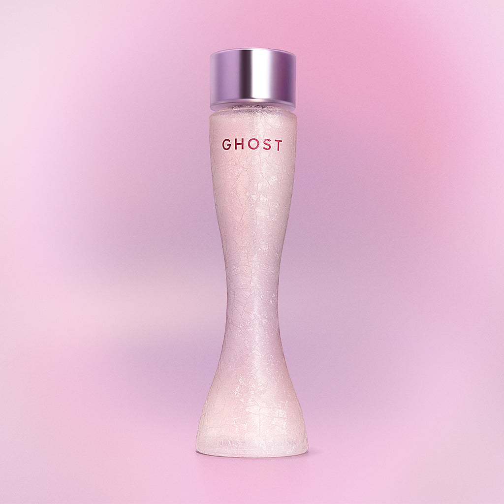 Ghost perfume bottle on a pink gradient background